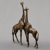 Handcrafted giraffe figurines, antique copper finish, pair facing forward