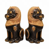 Handcrafted brass lion pair statues, side view with ornate gold mane and chain collar