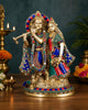 Brass Radha-Krishna statue with colorful stone inlay, seated figures and cow at base