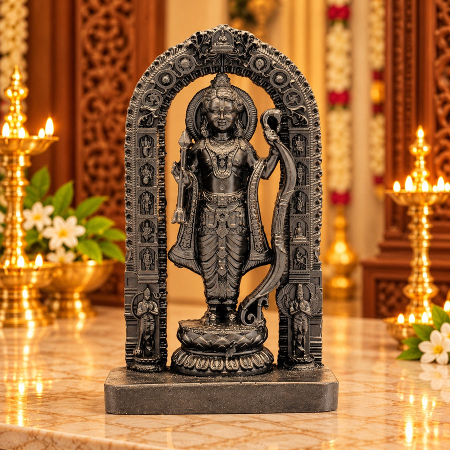 Dark resin Ram Lalla statue in arched frame, seated figure holding ceremonial items