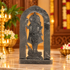 Dark resin Ram Lalla statue silhouette in arched frame, seated profile on square base