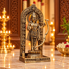 Brass deity statue in ornate arch with bow, upright posture, side view