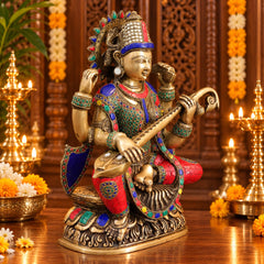 Brass Goddess Saraswati Idol Seated on Lotus with Sitar | Exquisite Stonework and Golden Finish for Home Temple & Décor (Height: 16.5 Inches)