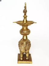 Brass peacock oil lamp on elephant stand statue, rear view