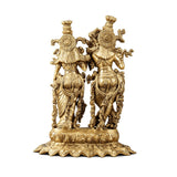 Brass Radha Krishna statue (14 in), side view of ornate backs and pedestal.