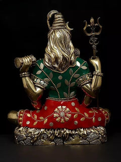 Back view of brass Lord Shiva statue, long hair and green patterned upper cloth