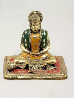 Small brass Hanumanji murti with green patterned vest, seated on red gold base