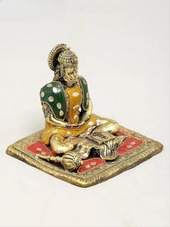 Small brass Hanumanji murti, side view, green vest with white dots, seated pose