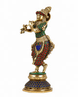 Brass Krishna figurine with raised flute hand, jeweled green and red bodice
