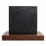 Karungali wooden Shree Yantra plaque with centered engraved yantra in dark square, on wooden stand