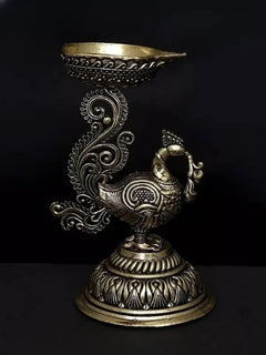 Brass peacock diya statue, 5-inch height, profile view with patterned base and bowl