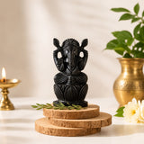 Dark ebony wood Lord Ganesha idol on lotus base with round stacked pedestal