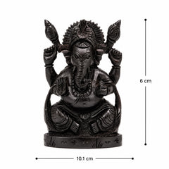 Lord Ganesha bust statue, black finish, raised arms, detailed jewelry, seated on round base
