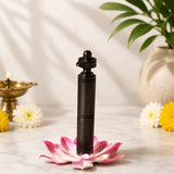 Natural ebony wood shivling stand with carved finial, set on pink lotus flower