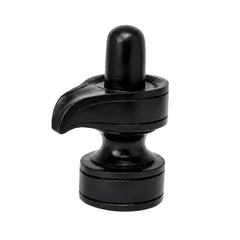 Black shivling idol with tall rounded top and curved leaf-like base on pedestal