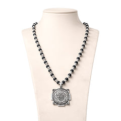 Black bead mala necklace with silver cap and square-backed circular Yantra pendant