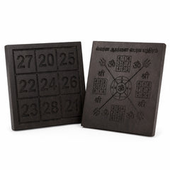 Pair of dark yantra boards with number panels on the left and symbol chart on right