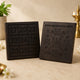 Two black yantra tiles, left date grid and right geometric symbols for sacred wealth
