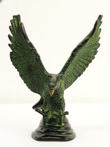 Brass Eagle statue on base, forward view, detailed feather texture, green patina