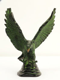 Brass Eagle statue on base, forward view, detailed feather texture, green patina