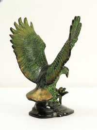 Brass Eagle statue, angled view, spread wings and talons on round base, green patina