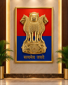 Brass Ashoka emblem wall hanging in a gold-toned wooden frame with red and blue backing.