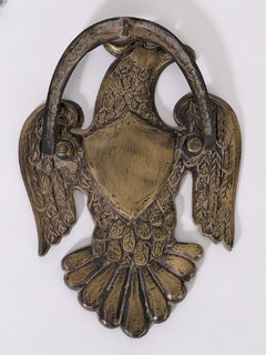 Brass eagle door knocker with ring handle and antiqued wings