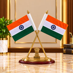 Brass desk flag stand with crossed Indian flags and an emblem on a wooden base