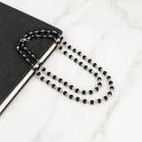 Black bead necklace with silver-toned connectors and matching bracelet set
