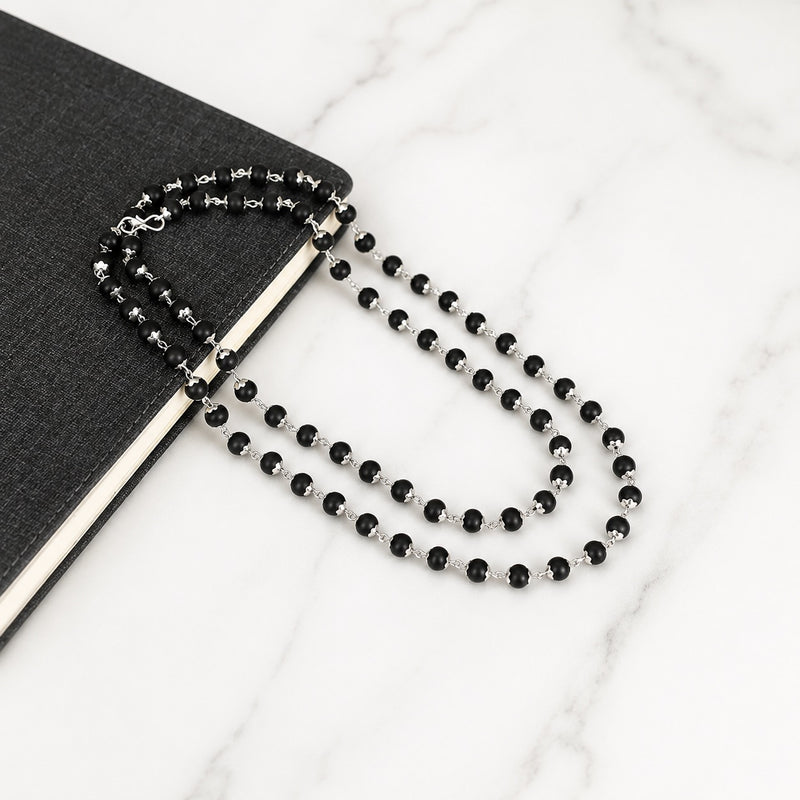 Black bead necklace with silver-toned connectors and matching bracelet set