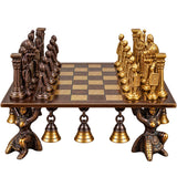 Chess set board with gold and dark figures, ornate brass bases and knights