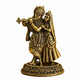 Antique brass Radha-Krishna idol with flute, raised figures on detailed round base