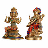 Brass Saraswati statue holding veena, seated on lotus base with colorful inlay