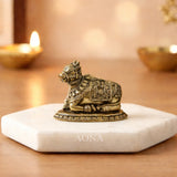 Brass Nandi bull idol, detailed ornate patterns, seated on round base