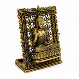 Brass Buddha panel, side view of seated Buddha with raised hand inside decorative frame
