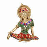 Brass Indra sculpture, seated with one hand resting, red crown and teal patterned jewelry.