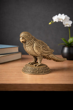 Brass parrot figurine, side view, detailed feather scales and engraved head band