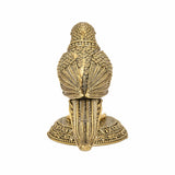 Brass parrot statue from back view, engraved wing lines over decorative round base
