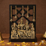 Brass Shiva family idol with hanging bells and wooden base, 12-in