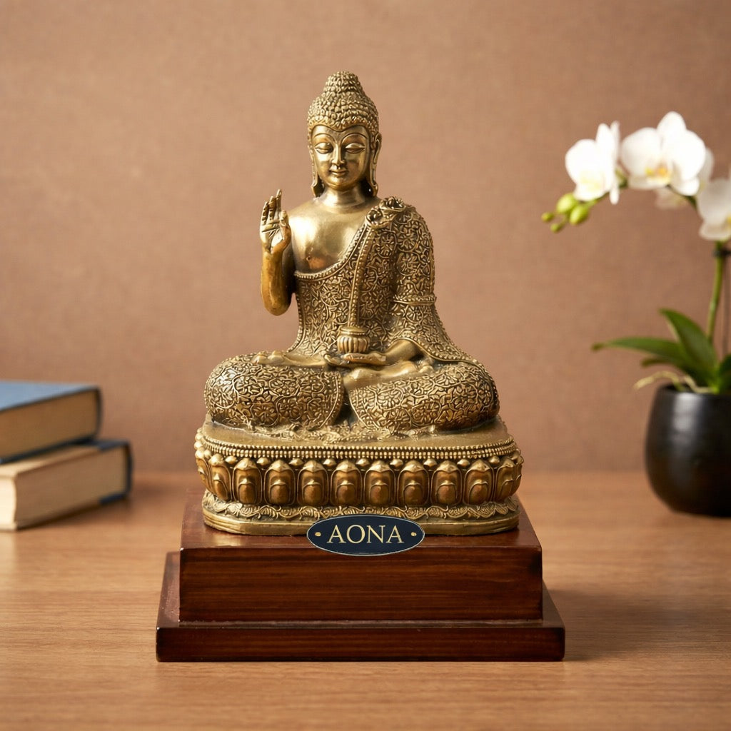 AONA brass Buddha statue in Abhaya mudra, seated on ornate wooden base