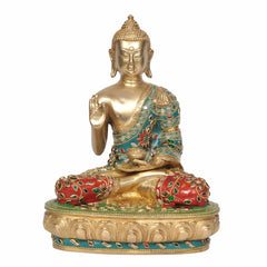 Brass Buddha idol seated in Abhaya mudra, gold body with turquoise and red jeweled robe