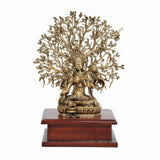 Brass Tara Devi seated statue with radiating tree canopy on wooden base
