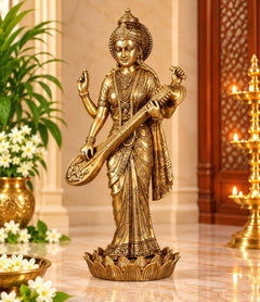 Brass Maa Saraswati statue holding veena, standing on decorated base, 24 in