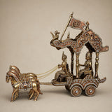 Ornate brass horse chariot sculpture with riders, gold-tone wheels, and wooden base