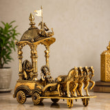 Brass chariot sculpture with banner, four horses, and wagon base with standing riders