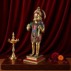 Brass Hanumanji statue in side view, raised hands and decorated jeweled robe