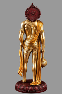 Back view Hanuman brass statue with gold drape, red crown halo, and dark red round base