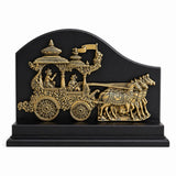 Front view of brass chariot ornament: charioteers and four horses on base