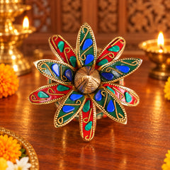 Decorative brass kalash top with eight blue-and-red jewel petals and gold center finial
