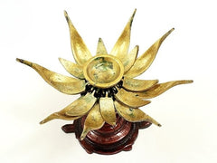 Gold brass lotus candle with glowing center and multi-petal outer frame